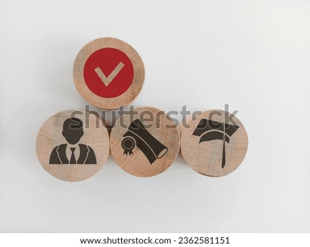 Wooden blocks with qualifications, certificates and graduate icons. The concept of academic qualifications. The concept of required skills.  Royalty-Free Stock Photo #2362581151
