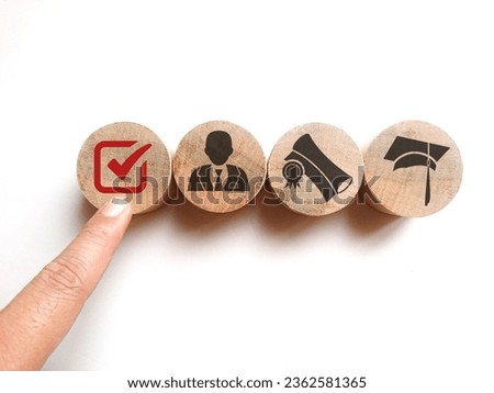Wooden blocks with qualifications, certificates and graduate icons. The concept of academic qualifications. The concept of required skills.  Royalty-Free Stock Photo #2362581365
