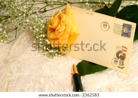 a yellow rose and vintage postcard ,close up shot