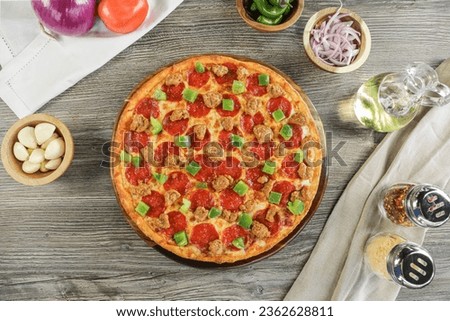 Yummy pizza with extra topping around the ingredients 