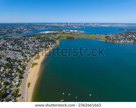 Wollaston Beach aerial view and Quincy Shore Drive next to the beach in Quincy Bay with Boston modern skyline at the background in Wollaston, city of Quincy, Massachusetts MA, USA. 