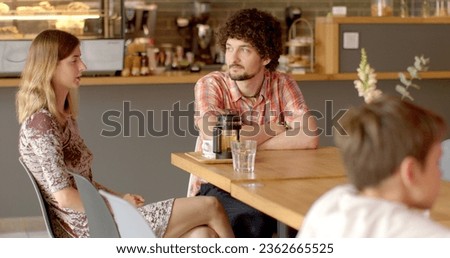 Adult siblings sit at table in restaurant, discussing childhood traumas they both experienced in past. Exchange support, advice, stories about how they cope with aftermath of their experiences. Life Royalty-Free Stock Photo #2362665525