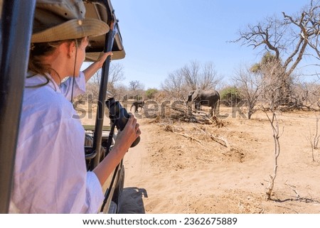 Watching an elephant really close out of a car at a safari in Africa Royalty-Free Stock Photo #2362675889