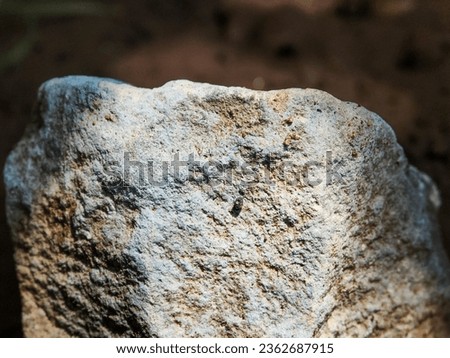Close up of stone object below the sun shadow Stone background for nature concept photography