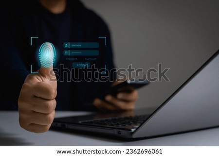 Cyber security concept. Businessman login with fingerprint scanning technology. fingerprint to identify personal. Fingerprint scan provides security access with biometrics identification. Royalty-Free Stock Photo #2362696061