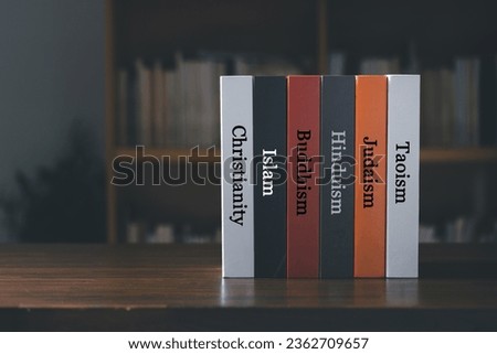 Book spines listing major world religions - Christianity, Islam, Hinduism, Buddhism, Taoism and Judaism. religion concept.