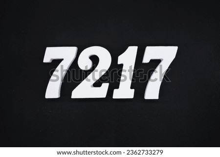 Black for the background. The number 7217 is made of white painted wood.