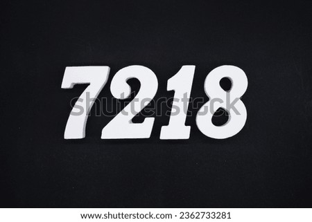 Black for the background. The number 7218 is made of white painted wood.