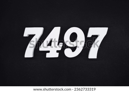 Black for the background. The number 7497 is made of white painted wood.