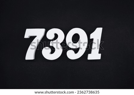 Black for the background. The number 7391 is made of white painted wood.