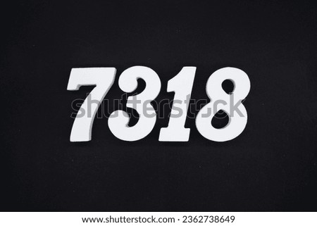 Black for the background. The number 7318 is made of white painted wood.