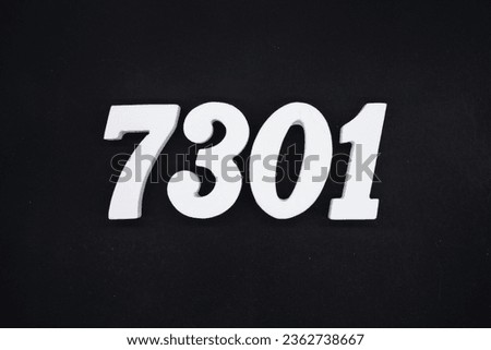 Black for the background. The number 7301 is made of white painted wood.
