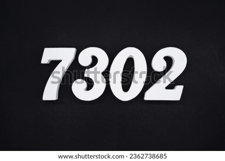Black for the background. The number 7302 is made of white painted wood.