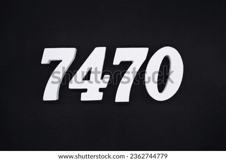 Black for the background. The number 7470 is made of white painted wood.