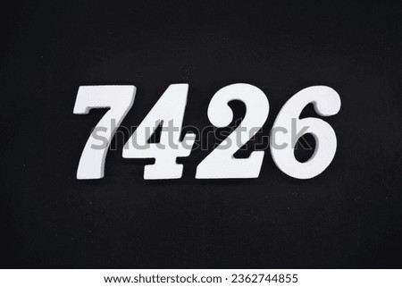 Black for the background. The number 7426 is made of white painted wood.