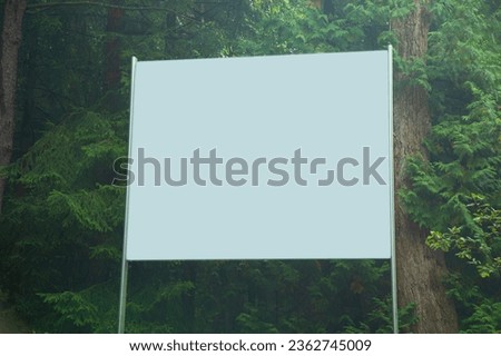Empty billboard in forest for advertising.