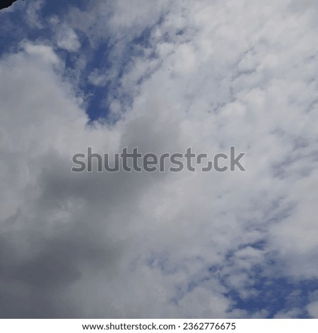white and gray clouds cover the blue sky