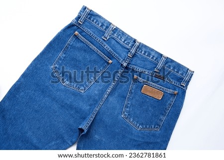 Top view, jeans trouser on a white background . show back pocket denim in store and supermarket.concept fashion dress jeans. Royalty-Free Stock Photo #2362781861