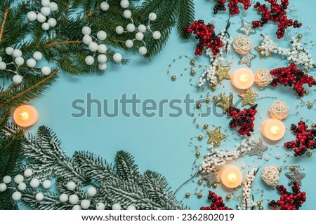 Christmas pattern on a light blue background with colorful decoration ornaments things. Concept of winter, christmas or new year. Flat lay