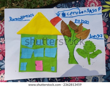 A kid’s colorful paper art showing a house, a tree and a plant with Indonesian words on each picture