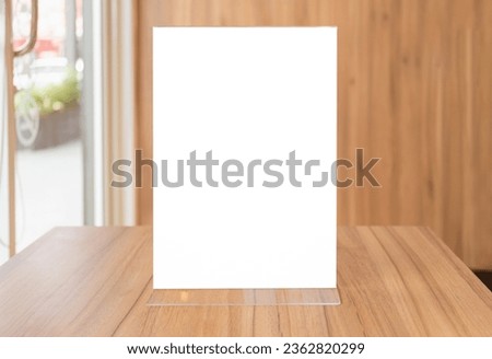Mock up image of Blank flyer mockup glass plastic transparent holder poster display in coffee shop