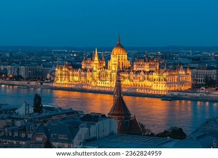 A picture of the Hungarian Parliament Building at night.