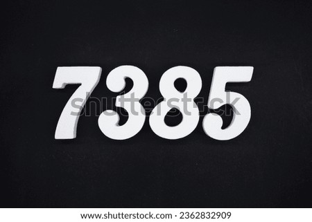 Black for the background. The number 7385 is made of white painted wood.