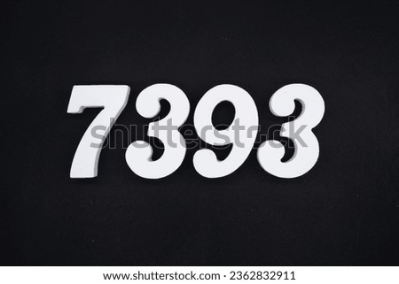 Black for the background. The number 7393 is made of white painted wood.