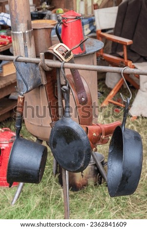 Cowboy camp cooking stove and metal cooking utensils