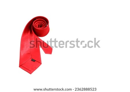 a red tie rolled on white background, single object concept, isolated on white background, copy space for texting and commercial usage, nobody in the scene 