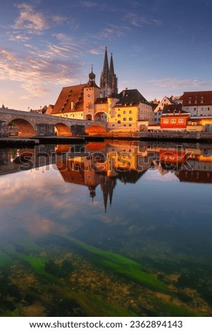 Regensburg, Germany. Cityscape image of Regensburg, Germany with Old Stone Bridge over Danube River and St. Peter Cathedral at autumn sunrise. Royalty-Free Stock Photo #2362894143