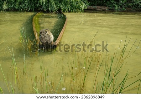 Old wooden sunken boat. Calm water. Svitiaz Lake, Shatsk National Natural Park, Volyn, Ukraine. Copy space.