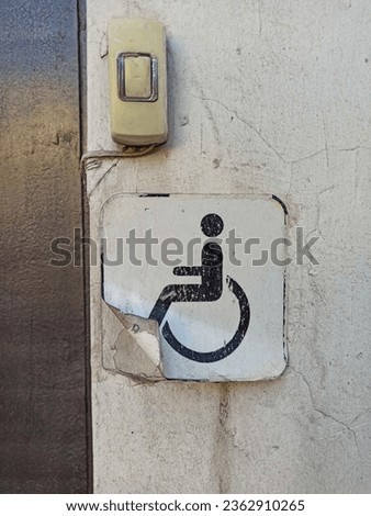 Handicap sign on the door of a house, closeup of photo