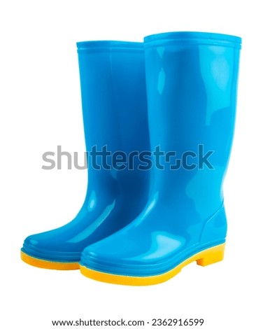 Pair of blue and yellow rubber boots isolated on white background, Saved clipping path. Royalty-Free Stock Photo #2362916599