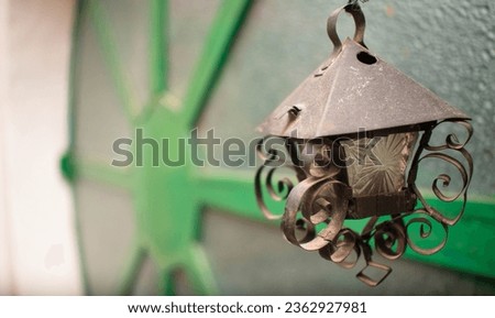 Old alcohol lamp or antique candle on a window ideal for backgrounds and artistic photography