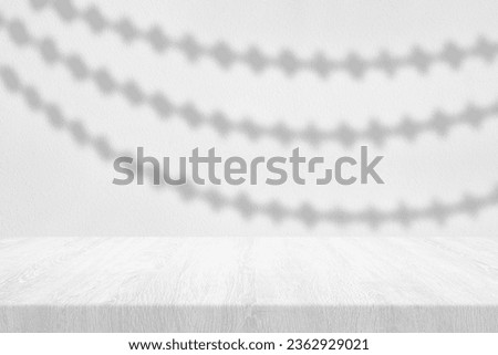 White Wood Table with Floral Curtain Shadow on Concrete Wall Texture Background, Suitable for Product Presentation Backdrop, Display, and Mock up.
