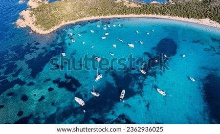Aerial view of Capo Coda Cavallo Beach (Tail of the horse), San Teodoro, Sardinia Island, Italy. Drone view of yachts in a clear sea water, mediterranean. Tavolara and Molara Island, Sardegna.