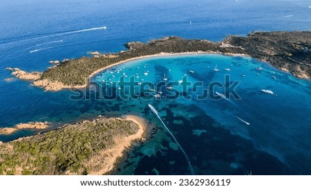 Aerial view of Capo Coda Cavallo Beach (Tail of the horse), San Teodoro, Sardinia Island, Italy. Drone view of yachts in a clear sea water, mediterranean. Tavolara and Molara Island, Sardegna.