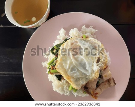 a photography of a plate of food with a cup of soup, consommeganized meal on a plate with a cup of soup.