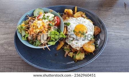 Tyrol Groestl (Tiroler Gröstl): Known as Gröstl, this bacon, onion, and potato fry-up is a real Alpine filler and tastes great served with a fried egg. Royalty-Free Stock Photo #2362960451