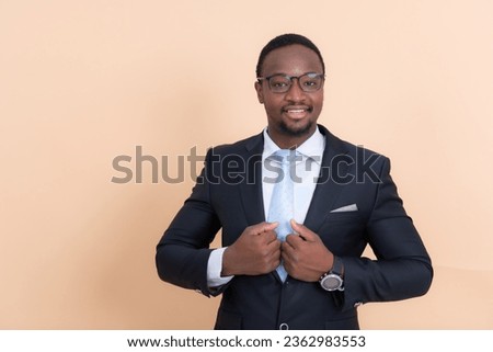 Portrait of confident african american businessman standing with arms crossed.