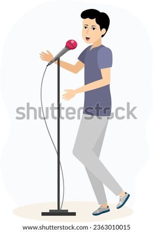 Musical concert. Cute young man with a microphone sings in a karaoke club or recording studio.