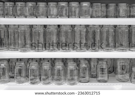 Glass jars on the shelf in the store, transparent background