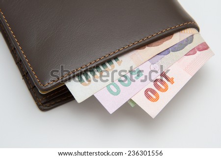 Thai Money in Leather wallet on white background