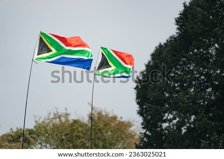 South African flags flying at full mast