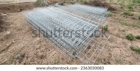 photo of iron BRC (British Reinforced Concrete) type fence, or it could also be called a roll top fence. BRC type fence is welded with a rolled triangular structure at the top and bottom.