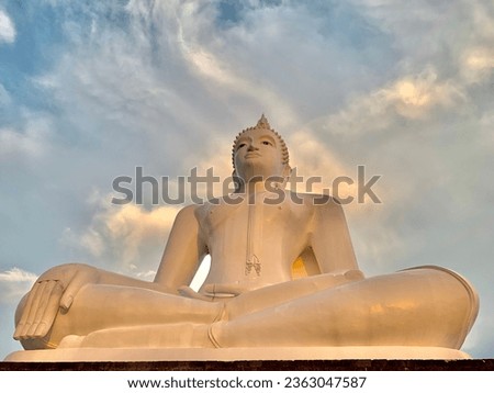 Big white Buddha statue and blue sky
