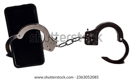 Cell Phone and handcuffs to show being shackled to their cellphone Royalty-Free Stock Photo #2363052085