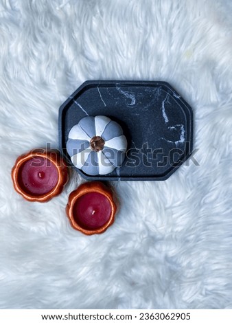Coloured Pumpkins on Marble Tray with White Textured Background Flat Lay Photography.