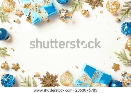 Christmas concept. Flat lay composition with blue and gold decorations, luxury gifts, confetti, fir branches isolated on white background. Happy New Year greeting card template, Xmas banner mockup